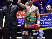 Wanchana Meenayothin of Thailand celebrates after winning his bout against Omar Elquers of Morocco during the WBC Asia Super Featherweight (...