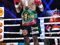 Wanchana Meenayothin of Thailand poses for photo after winning his bout against Omar Elquers of Morocco during the WBC Asia Super Featherwei...