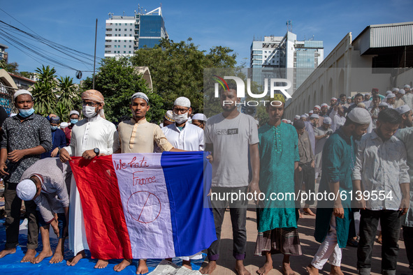 Muslims take part in a protest calling for the boycott of French products and denouncing French president Emmanuel Macron for his comments o...