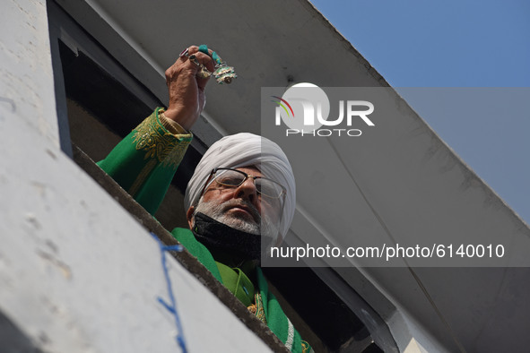 Head cleric displaying holy relic on the occasion of celebration of Mawlid-un-Nabi or Prophet Muhammad's (PBUH) birth anniversary in Dargah...