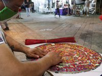Craftsman Mario Garcia, manufactures a crafts with the design of Stone of the Sun generally known as Aztec Calendar handmade with Popotillo...