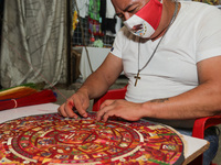 Craftsman Mario Garcia, manufactures a crafts with the design of Stone of the Sun generally known as Aztec Calendar handmade with Popotillo...