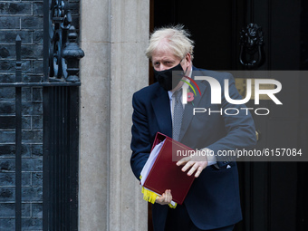  British Prime Minister Boris Johnson leaves 10 Downing Street for PMQs at the House of Commons on 04 November, 2020 in London. England is d...