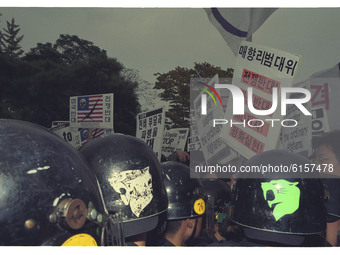 This Pictures taken date is 2003. A Protesters hold pickets scuffled riot police during a  anti-war rally about South Korean government Iraq...