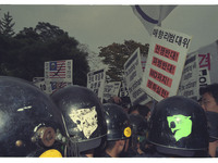 This Pictures taken date is 2003. A Protesters hold pickets scuffled riot police during a  anti-war rally about South Korean government Iraq...