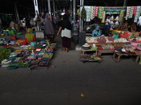 Traders are waiting for buyers in the middle of a market that is empty of visitors at Masomba Traditional Market in Palu, Central Sulawesi P...