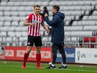  Max Power celebrates with Andrew Taylor, first team coach after scoring his sides first goal of the match during the Sky Bet League 1 match...