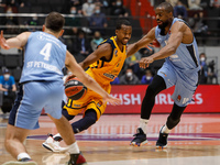 Errick McCollum (C) of Khimki in action against Kevin Pangos (L) and Will Thomas (R) of Zenit St Petersburg during the EuroLeague Basketball...