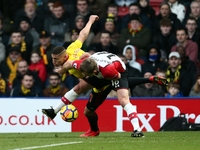 Richarlison of Watford battles for the ball against James Ward-Prowse of Southampton during the Premier League match between Watford and Sou...