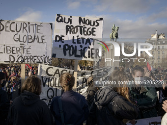 People gather at the Trocadero, responding to the call of several unions, to protest against the global security bill, the day after the app...