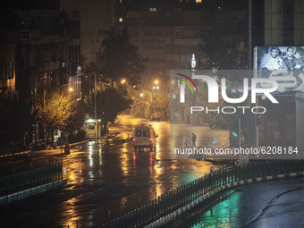 An ambulance drives along an avenue which is empty of vehicles in central Tehran at night as the Capital city is in lockdown for the second...