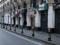 People walk in downtown Algiers, November 23, 2020. A new set of restrictions have been put in place in Algeria to curb COVID-19.  (