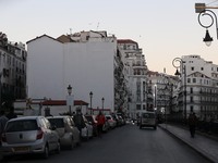 People walk in downtown Algiers, November 23, 2020. A new set of restrictions have been put in place in Algeria to curb COVID-19.  (
