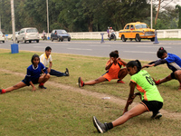 Indian young girls maintain social distances and  play hockey at the practice session Street side ahead Coronavirus pandemic situation in Ko...