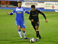   Oldham Athletic's Cameron Borthwick-Jackson tussles with Barrow's Scott Quigley during the Sky Bet League 2 match between Barrow and Oldha...