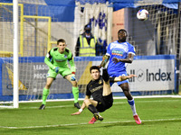   Oldham Athletic's Bobby Grant shoots for goal under pressure from Barrow's Yoan Zouma during the Sky Bet League 2 match between Barrow and...
