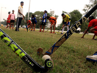 Indian young women players  maintain social distances and  play hockey at the practice session Street side ahead Coronavirus pandemic situat...