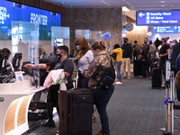 Orlando, Florida, United States - People check in for departing flights at Orlando International Airport on Thanksgiving eve, November 25, 2...