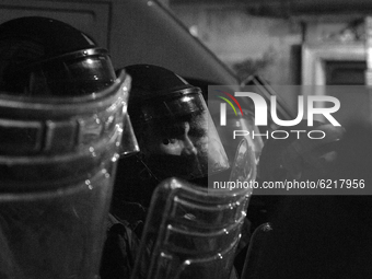 (EDITOR'S NOTE: Image was converted to black and white) A riot policeman during the demostration in Roma organized by left movements after t...
