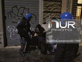 Police officers arrest a protester during the demostration in Roma organized by left movements after the eviction of the ''Nuovo Cinema Pala...