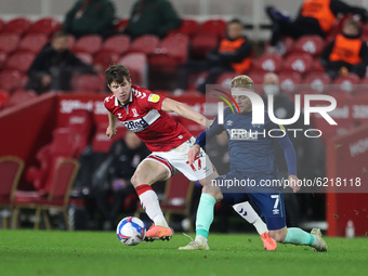 Paddy McNair of Middlesbrough in action with Kamil Jozwiakk during the Sky Bet Championship match between Middlesbrough and Derby County at...
