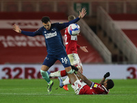 Lee Buchanan of Derby County in action with Middlesbrough's Britt Assombalonga during the Sky Bet Championship match between Middlesbrough a...