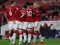 Marvin Johnson of Middlesbrough celebrates with his team mates after scoring their third goal during the Sky Bet Championship match between...