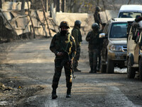  An Indian army soldier guards the main road near the site of attack at HMT area of Srinagar,Kashmir on November 26,2020.Inspector General o...
