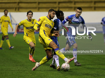 Dimitri Sea of Barrow in action with Wimbledon's Terell Thomas  during the FA Cup match between Barrow and AFC Wimbledon at the Holker Stree...