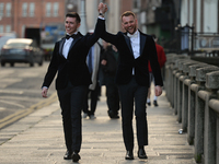 Happy Mark and Cathal walking hand in hand next to Government Buildings just after taking their wedding vows in Dublin's city centre.
On Fri...