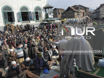 People pray outside Khanyar shirine on the eve of urs of Sheikh Abdul Qadir Jeelani in Srinagar, Indian Administered Kashmir on 27 November...