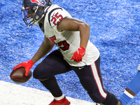 Houston Texans running back Duke Johnson (25) runs the ball into the endzone during the first half of an NFL football game between the Detro...