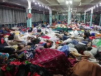 People sleep on the deck of a passenger ferry as they traveling from Dhaka to southern part, in Barishal, Bangladesh on November 28, 2020....