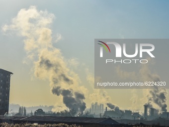 Smoke rises from the chimneys of a factory in Etimesgut district on November 28, 2020 in Ankara, Turkey. (