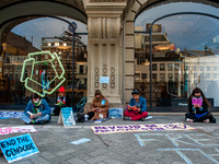 Activists from the climate organization Extinction Rebellion carried out an action against the Apple brand in front of the Apple Store in th...