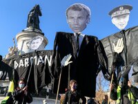 Demonstrators hold effigies of French President Emmanuel Macron, French Interior Minister Gerald Darmanin and Paris police prefect Didier La...