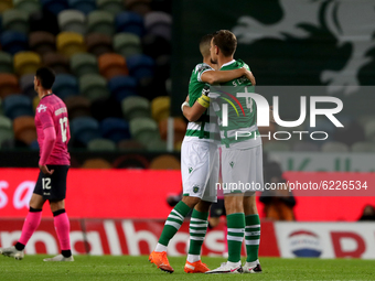 Sebastian Coates of Sporting CP (R ) celebrates a goal with Zouhair Feddal during the Portuguese League football match between Sporting CP a...