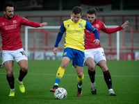 
Ryan Cooney of Morecambe FC tries to tackle Joe Sbarra of Solihull Moors FC   during the FA Cup 2nd Round match between Morecambe and Solih...