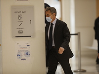 EX-President Nicolas Sarkozy arrives at his trial on corruption charges at Paris' courthouse on November 30, 2020. Prosecutors say Sarkozy p...