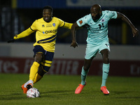 L-R Evans Kouassi of Canvey Island holds of Jamal Fyfield of Boreham Wood during  FA Cup Second Round between Canvey Island and Boredom Wood...