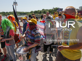 Participants of Kyiv Equality March 2015 walk by the city with rainbow flags, shouting equality slogans. Kyiv Equality March 2015, organized...