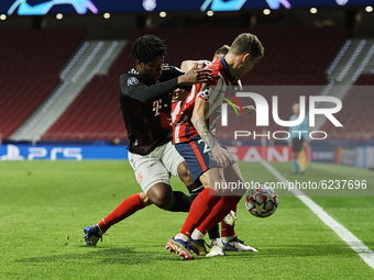 Arrey-Mbi of Bayern and Kieran Trippier of Atletico Madrid compete for the ball during the UEFA Champions League Group A stage match between...