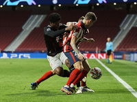 Arrey-Mbi of Bayern and Kieran Trippier of Atletico Madrid compete for the ball during the UEFA Champions League Group A stage match between...