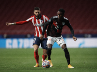 Bouna Sarr of Bayern and Yannick Carrasco of Atletico Madrid compete for the ball during the UEFA Champions League Group A stage match betwe...