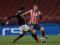 Mario Hermoso of Atletico Madrid and Leroy Sane of Bayern during the UEFA Champions League Group A stage match between Atletico Madrid and F...