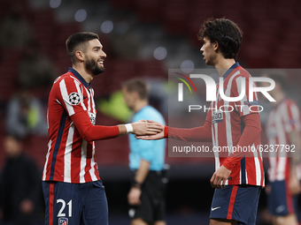 Joao Felix and Yannick Carrasco of Atletico Madrid greeting during the UEFA Champions League Group A stage match between Atletico Madrid and...