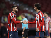 Joao Felix and Yannick Carrasco of Atletico Madrid greeting during the UEFA Champions League Group A stage match between Atletico Madrid and...