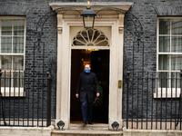 Secretary of State for Health and Social Care Matt Hancock, Conservative Party MP for West Suffolk, wears a 'Protect The NHS' face mask leav...