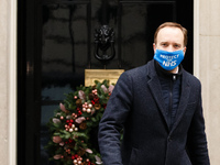 Secretary of State for Health and Social Care Matt Hancock, Conservative Party MP for West Suffolk, wears a 'Protect The NHS' face mask leav...