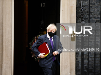 British Prime Minister Boris Johnson, Conservative Party leader and MP for Uxbridge and South Ruislip, wears a face mask leaving 10 Downing...